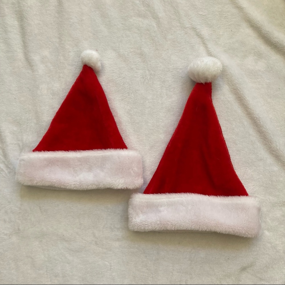 Set of two Santa hats with white pompoms
